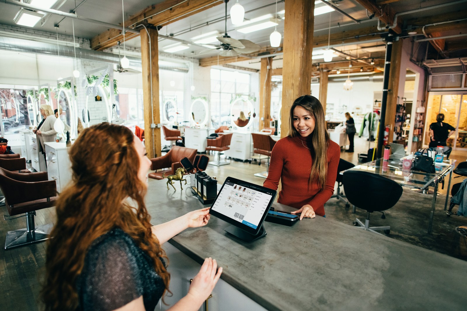 Photo by Blake Wisz two women near tables
